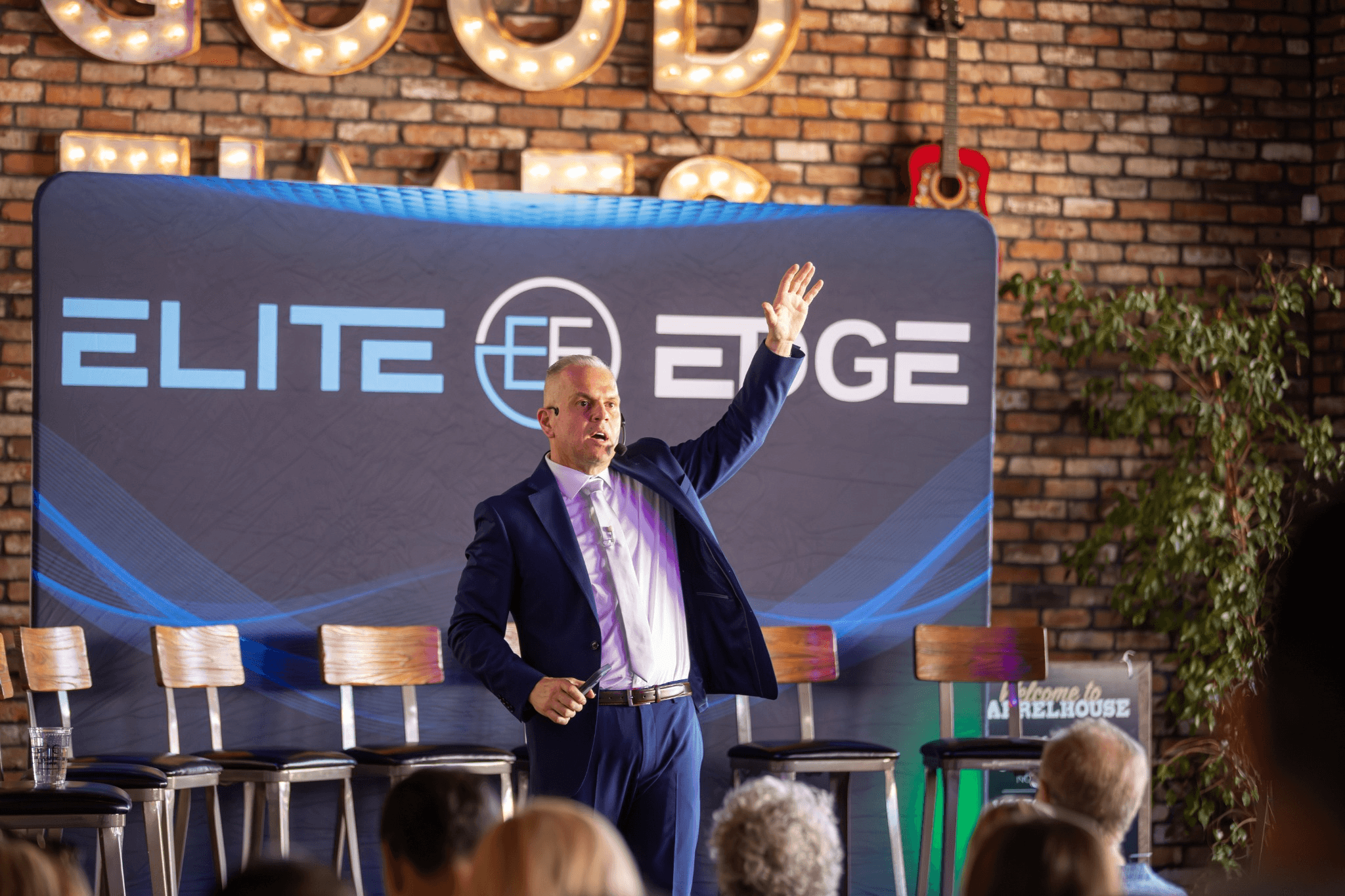 Chris Foster presenting to a live audience