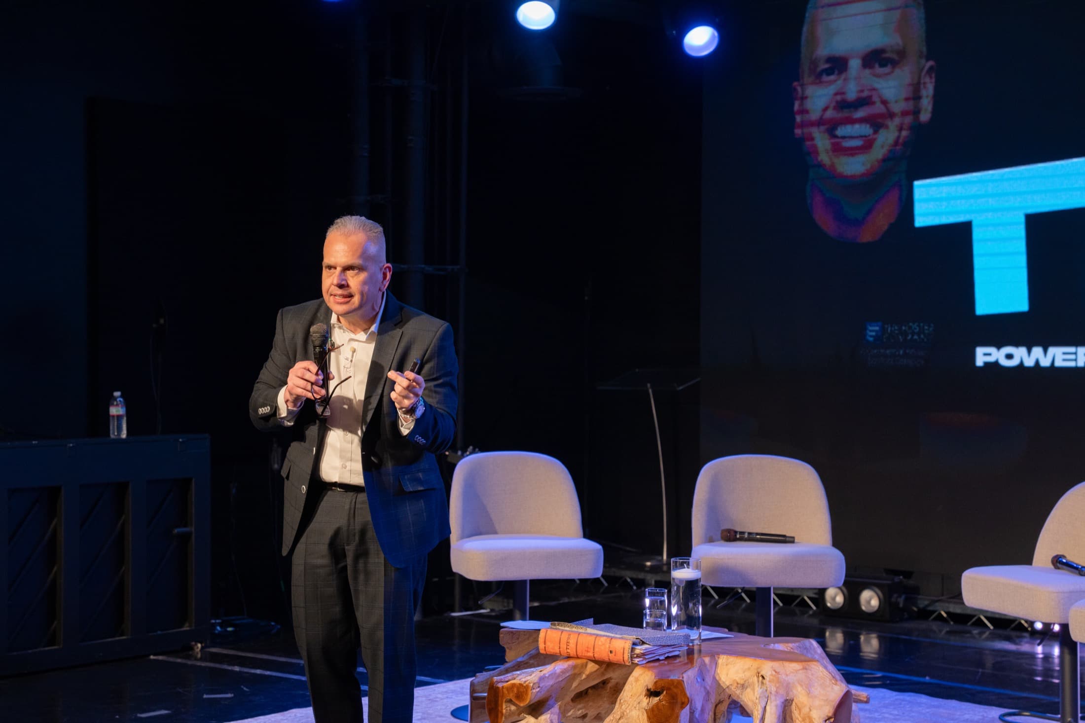 Chris Foster speaking on stage