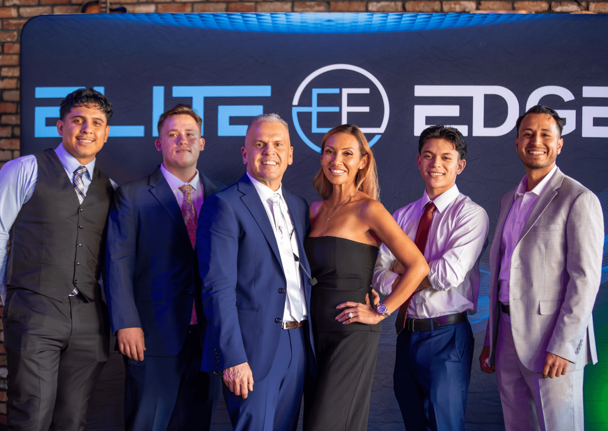 Chris Foster with event attendees and partners